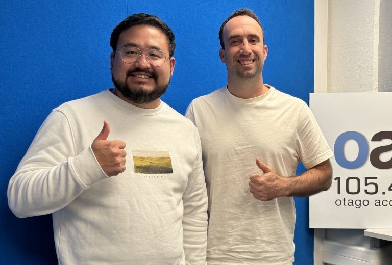 Hosts Zac and Jeremy in studio doing the thumbs up