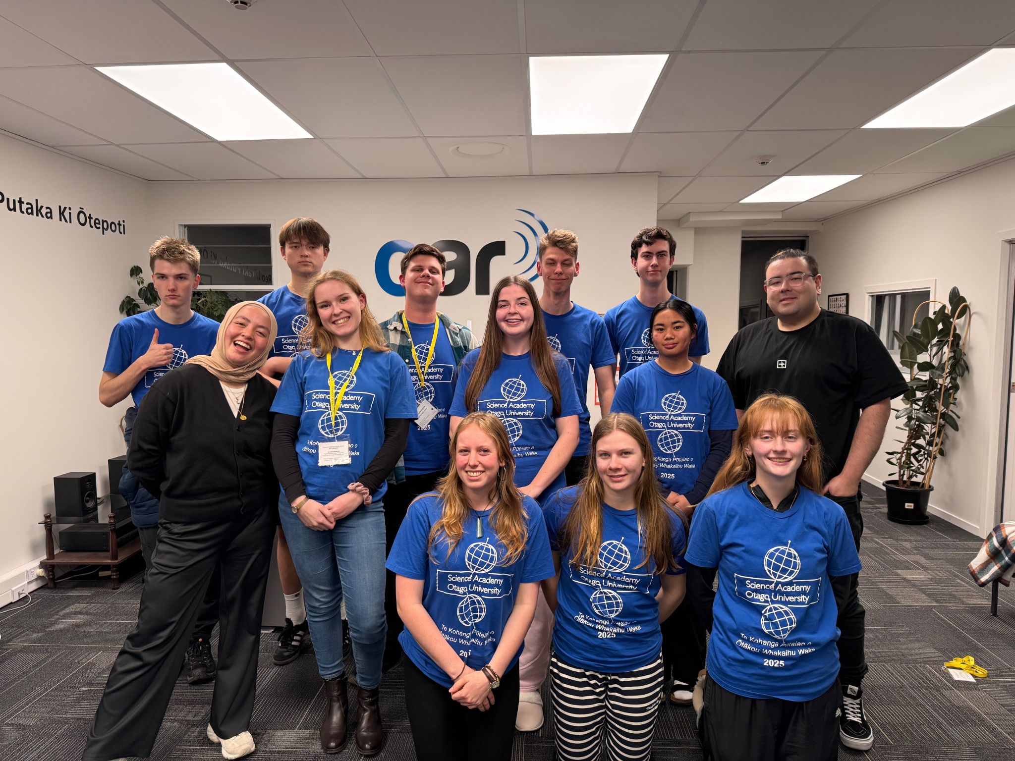 A group photo of 11 Science Academy students and 2 OAR FM staff members.