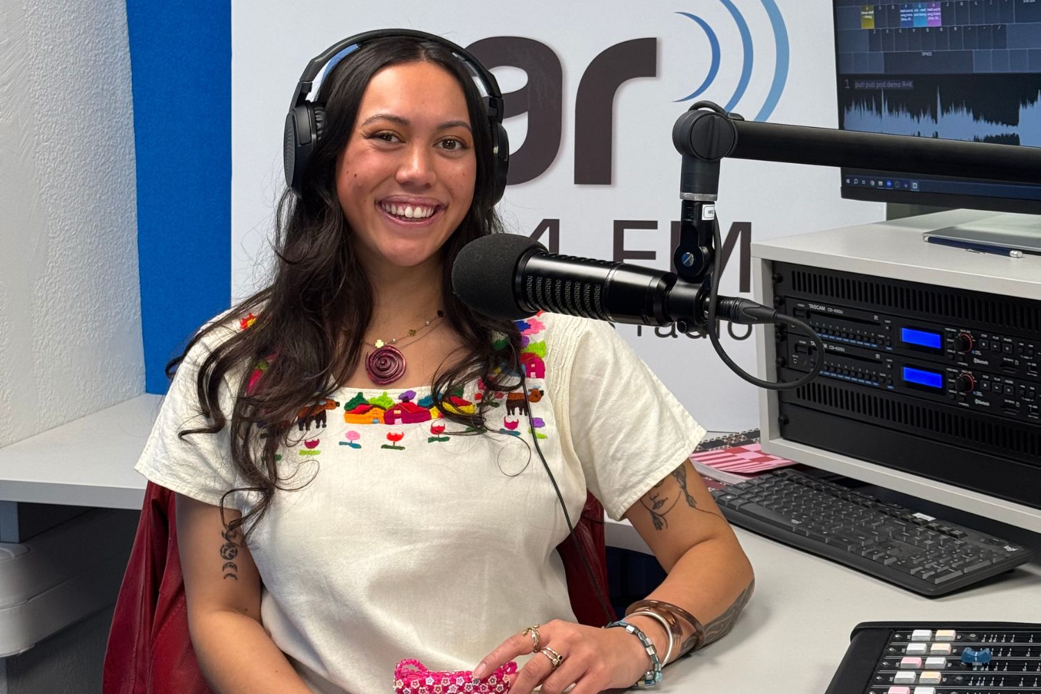 A photo of Moewai Marsh from Putiputi Pod infront of the microphones at OAR FM studios.
