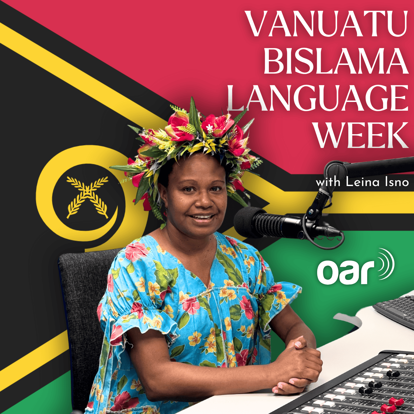 A photo of Leina Isno wearing a traditional Vanuatu attire, sitting infront of a microphone and Vanuatu Flag.