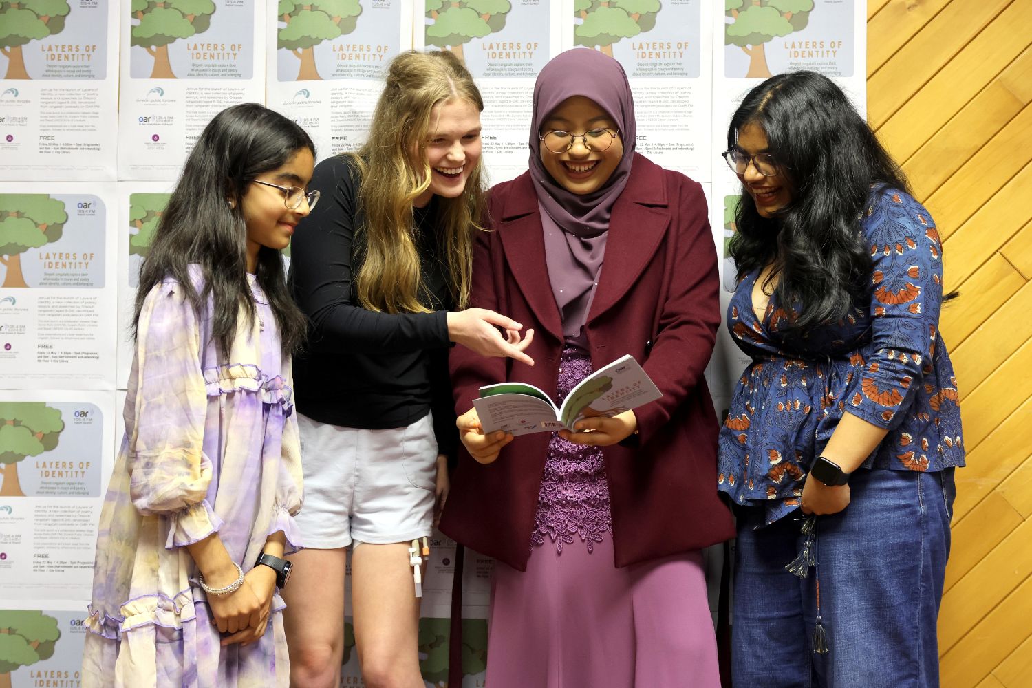 A photo of Parishay Khan, Vika Johnson, Asya Ahmadasri and Aahana Mundamattam at the Layers of Identity Book Launch