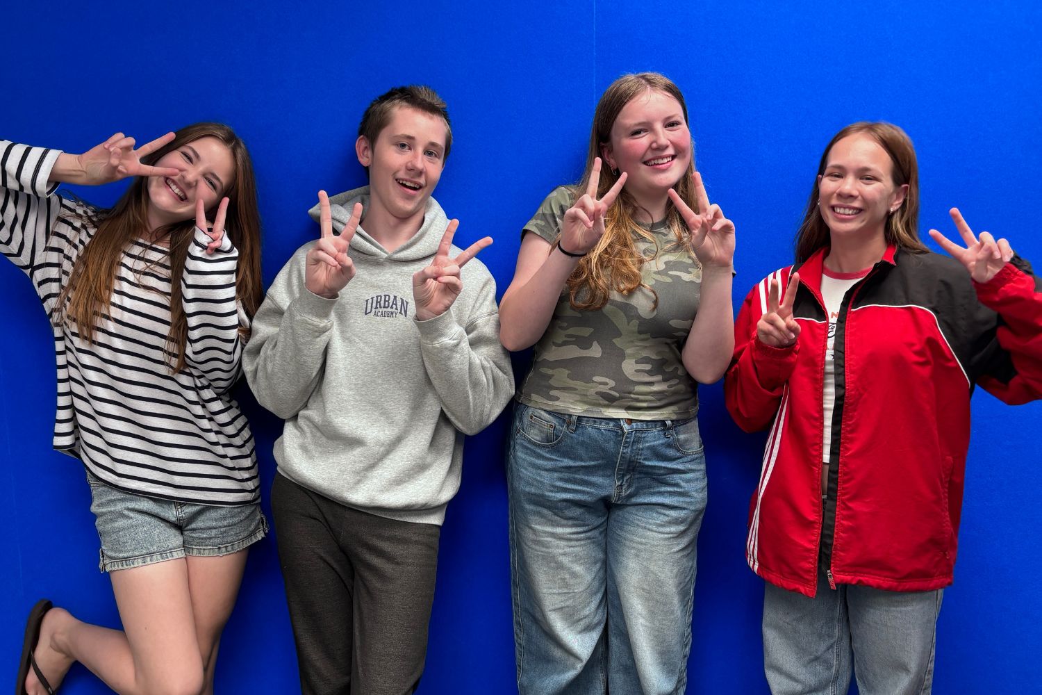 3 members of the Greater Green Island Youth Action Group members and Brianna Le Youth Worker pose after recording.