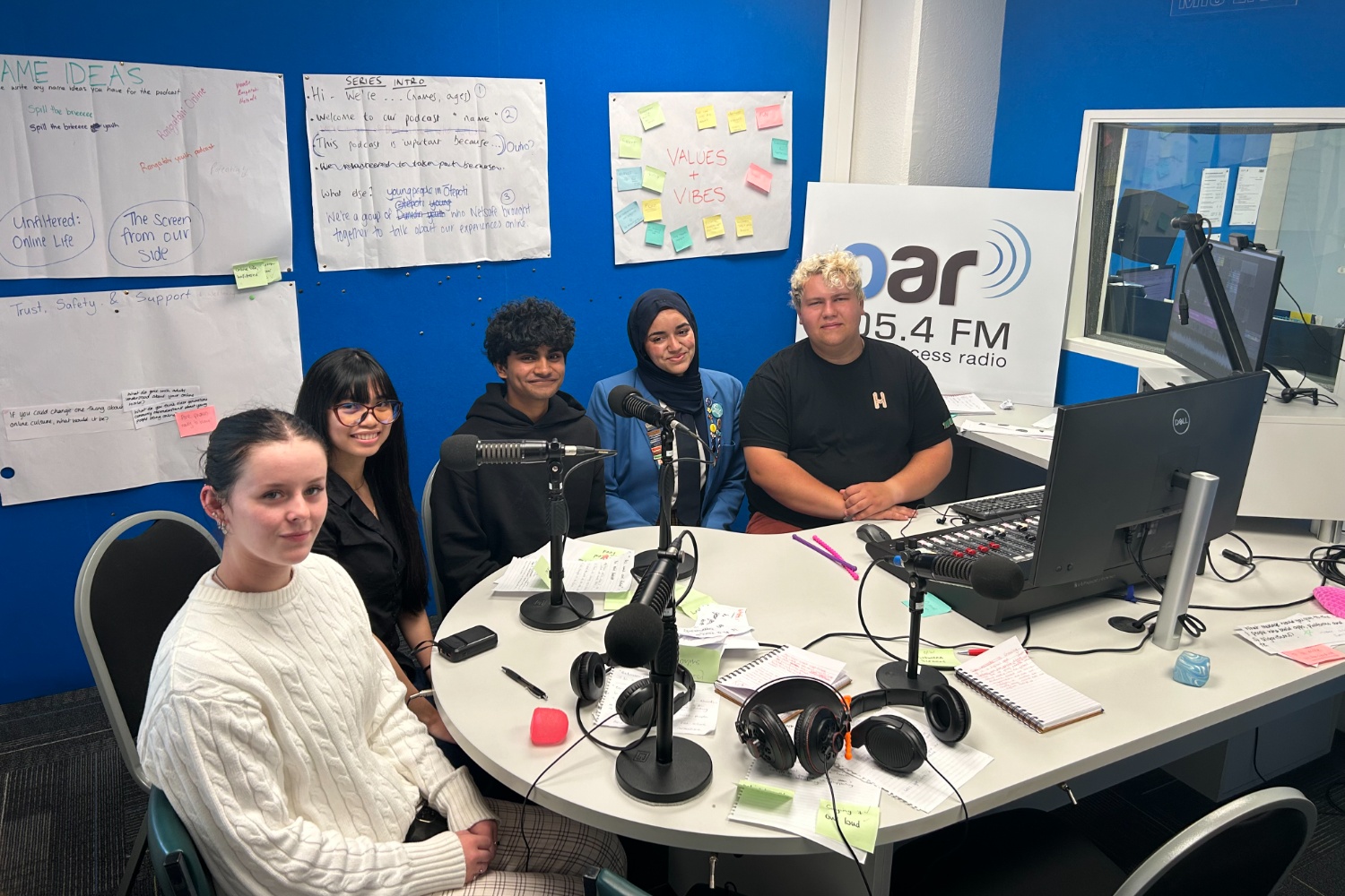 Grace Shemely, Betty Pagulayan, Shiva Kasibhatla, Malak Tamimi, Samuel Paton in the OAR FM Studio. With workshop documents in the background.